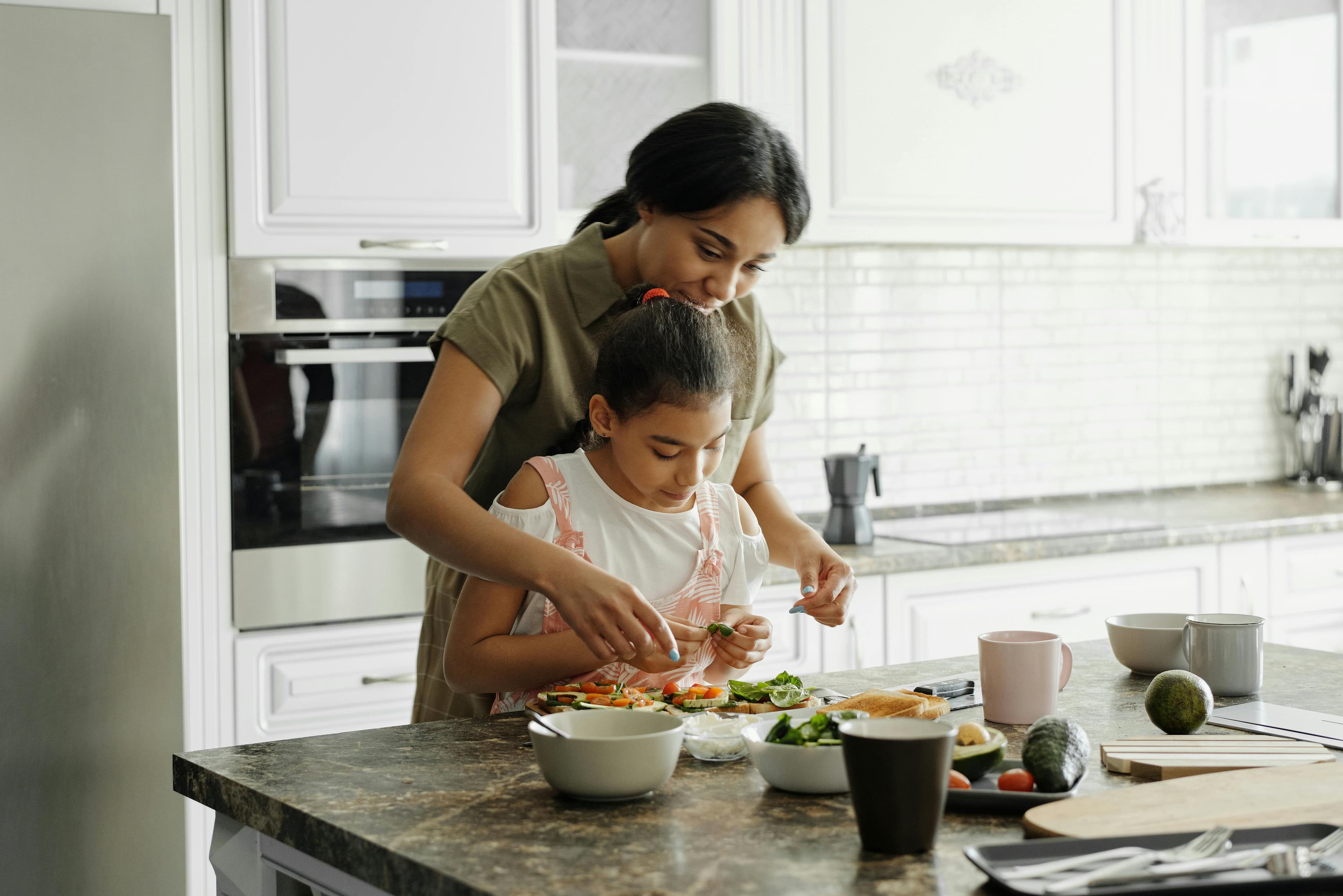 Professional kitchen with chef wearing apron